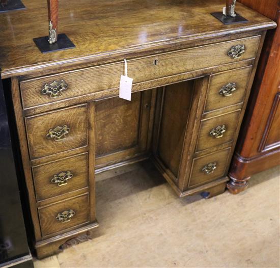 Small Georgian style oak kneehole desk
